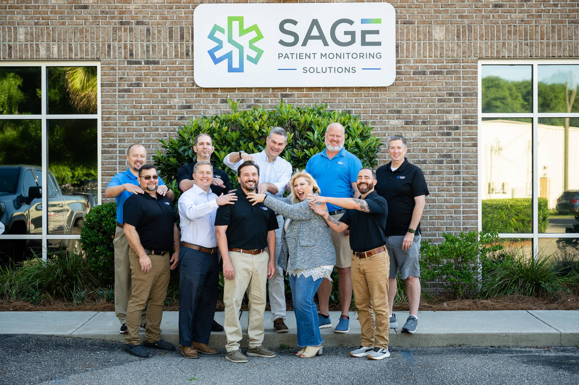 team photo 2026 team photo in front of building
