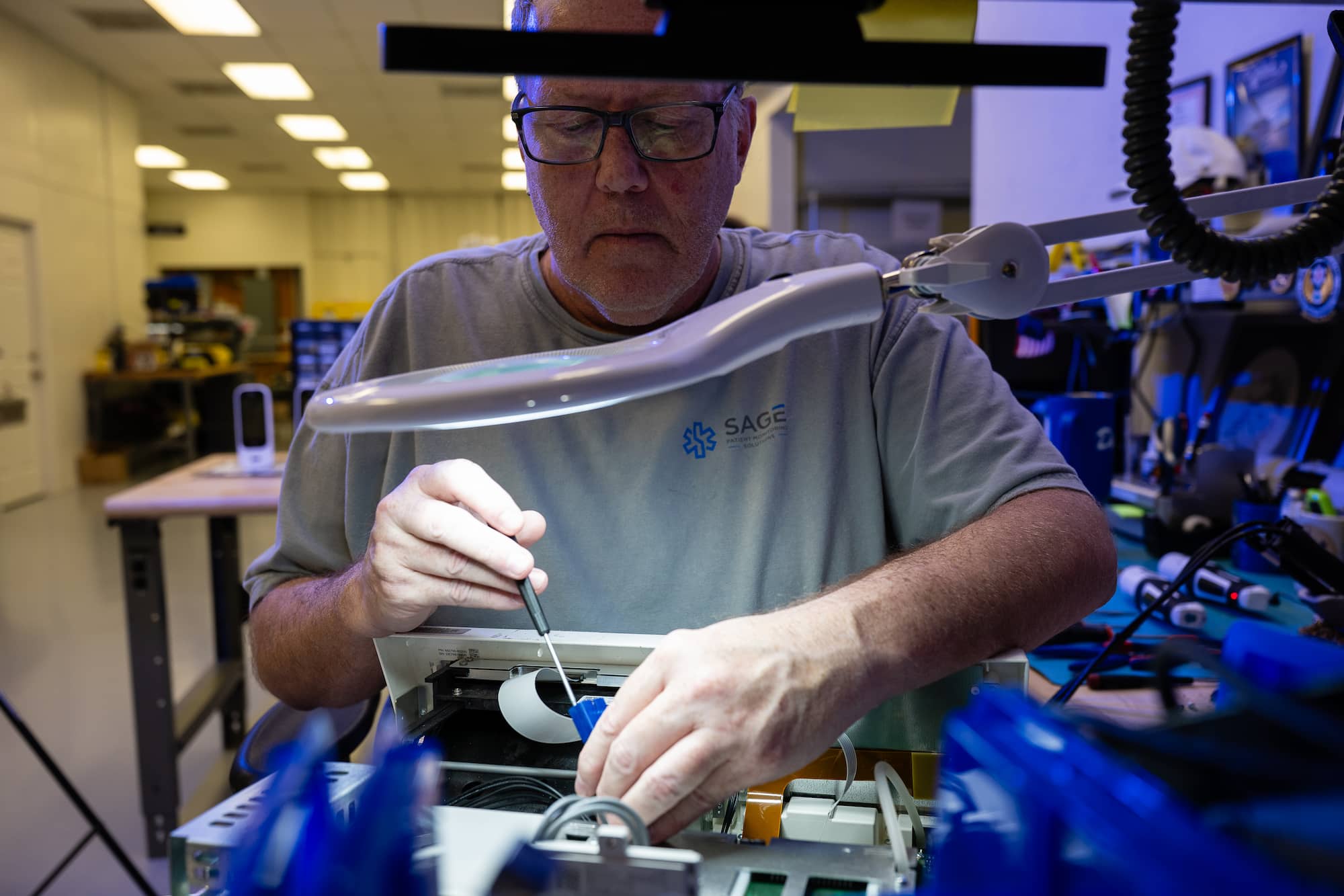 device on a table being repaired by a technician