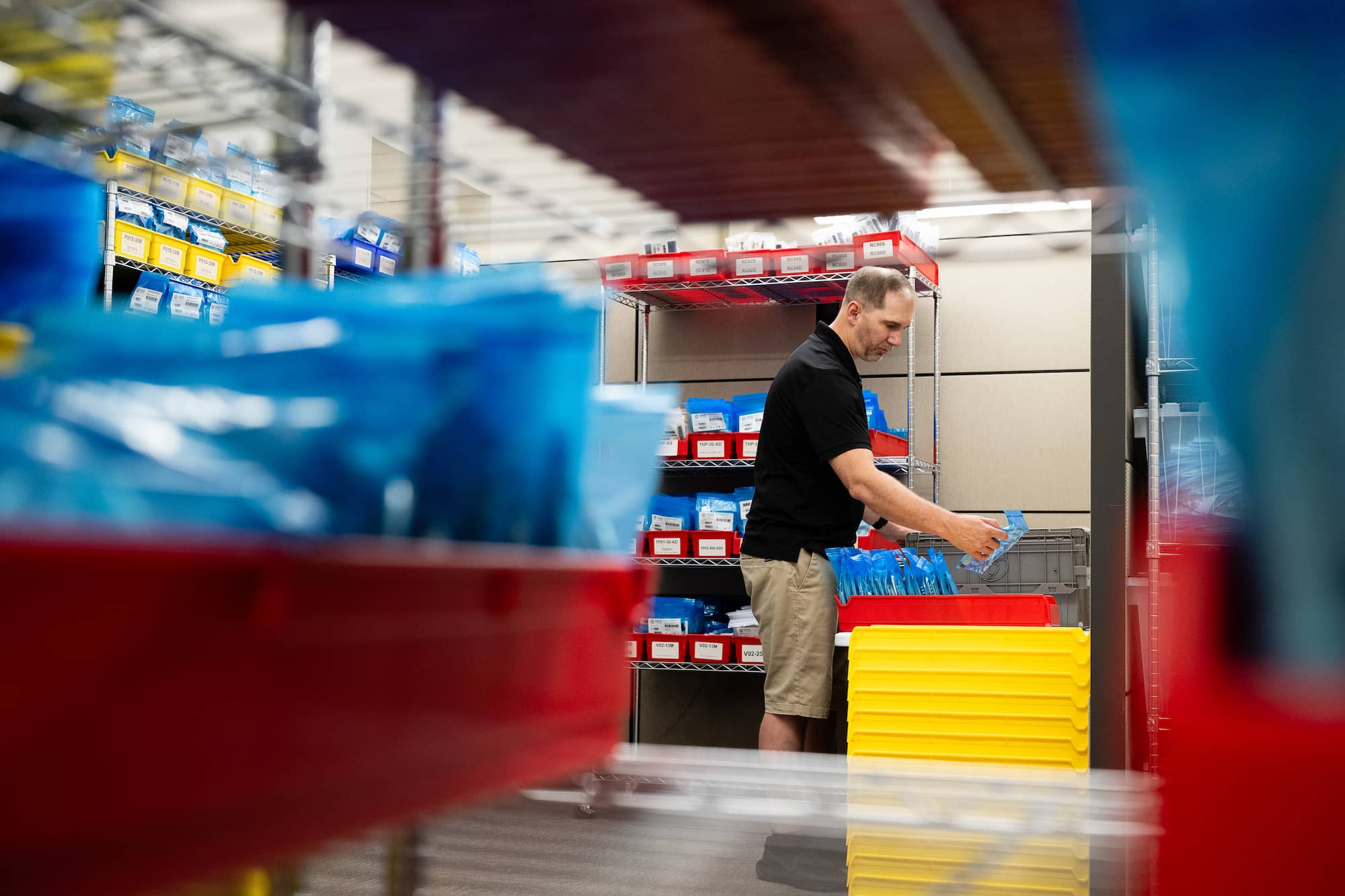 employee inspecting a cable